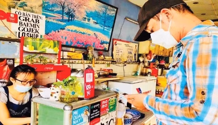 QR code payment is increasingly popular among small shops in Ho Chi Minh City.