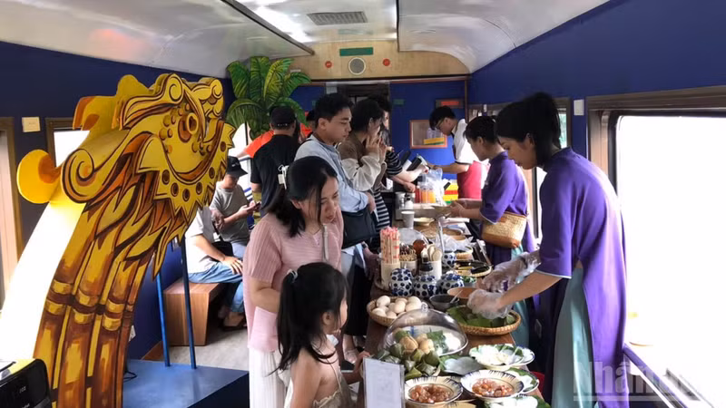 Passengers enjoy a meal aboard the Hue-Da Nang heritage train.