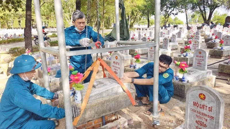 Personnel collect DNA samples from martyrs’ remains at the Road 9 National Martyrs' Cemetery.