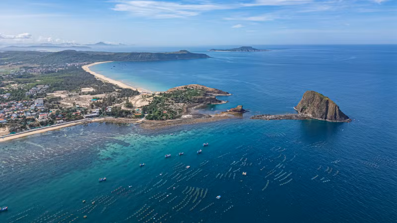 The coastal site comprises numerous rocky outcrops jutting into the sea.