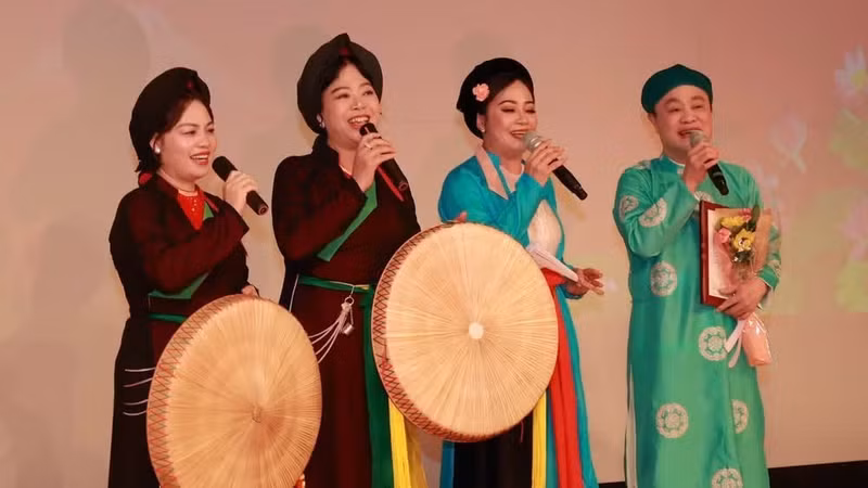 Artists deliver a performance at an event honouring Vietnamese culture.