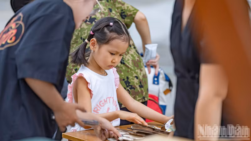 Children and young people enthusiastically craft their own unique works.