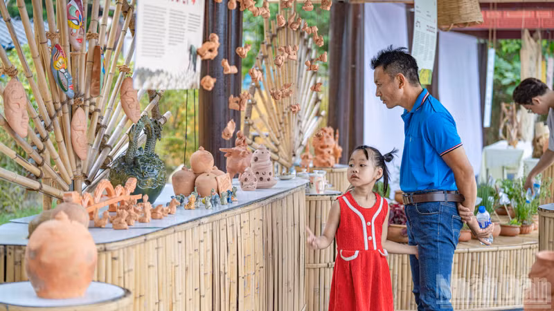 A display of terracotta pottery captivates children and families.