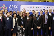 President Nguyen Xuan Phuc with delegates at the event (Photo: VNA)