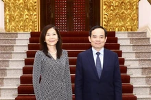 Deputy Prime Minister Tran Luu Quang (R) and UN Resident Coordinator in Vietnam Pauline Tamesis (Photo: VNA)