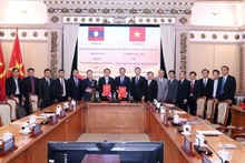 At the signing ceremony of the MoU. (Photo: VNA)