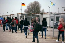 Eritrean migrants walk after arriving by plane from Italy at the first registration camp in Erding near Munich, Germany, November 15, 2016. (Photo: REUTERS)