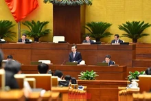 Minister of Construction Nguyen Thanh Nghi speaks at the NA session on November 3. (Photo: NDO)