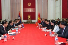 Participants at the meeting (Photo: VNA) 