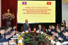 Khamphan Pheuyavong, Secretary of the LPRP Central Committee and head of its Commission for Propaganda and Training, at the working session. (Photo: NDO)