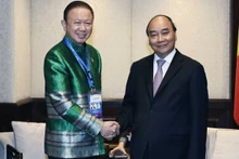 President Nguyen Xuan Phuc (R) and President of the Thailand-Vietnam Friendship Association (TVFA) Sanan Angubolkul. (Photo: VNA)