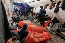 Migrants sleep on deck of NGO rescue ship 'Ocean Viking', in the Mediterranean Sea, November 6, 2022. (Camille Martin Juan/Sos Mediterranee/Handout via REUTERS)