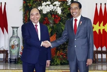 President Nguyen Xuan Phuc (L) and President Joko Widodo. (Photo: VNA)