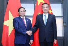 Prime Minister Pham Minh Chinh and Chinese Premier Li Keqiang (Photo: VNA)