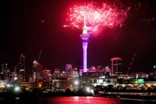 Large crowds flock to the Sky Tower in the centre of Auckland City, New Zealand, to immerse themselves in light and music. (Photo: AP)