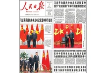 The People's Daily devoted more than half of its front page to solemnly publishing three photos between the two Party General Secretaries and the activities during the official visit. (Photo: HUU HUNG)