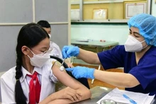 The total number of doses of COVID-19 vaccines injected reached 255,797,365. (Photo: tuoitre.vn)