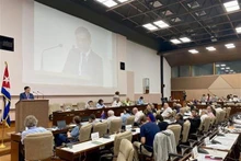 Deputy head of Party Central Committee's Commission for Internal Affairs Tran Quoc Cuong speaks at the 22nd IMWCP (Photo: VNA)
