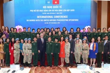 UN Under-Secretary-General for Peace Operations Jean-Pierre Lacroix (front, ninth from left), Deputy Defence Minister Hoang Xuan Chien (front, 10th from left), and other participants in the conference in Hanoi on November 26 (Photo: VNA) 