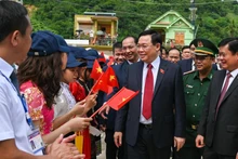 NA Chairman Vuong Dinh Hue and other delegates attend the inauguration ceremony of Ky Son High School.