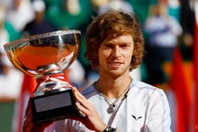Russia’s Andrey Rublev celebrates with the trophy after winning the Monte Carlo final against Denmark’s Holger Rune on April 16. (Photo: Reuters)