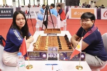 Vietnamse female chess player Doan Thi Hong Nhung (left) and Fillipo player Shania Mae Garcia Mendoza. (Photo: VNA)