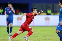 Le Quoc Nhat Nam celebrates scoring an equaliser for Vietnam during their last Group B clash against Thailand in the 32nd SEA Games on May 11.