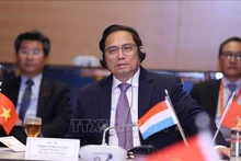 Prime Minister Pham Minh Chinh at the meeting with leaders of several large economic groups of Luxembourg and Europe (Photo: VNA)