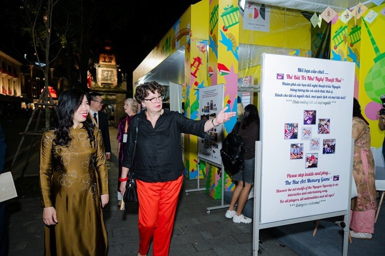 Deputy Minister of Foreign Affairs Le Thi Thu Hang and German Ambassador to Viet Nam Helga Margarete Barth visit the exhibition booths at Germany Festival 2025. (Photo: GIZ) lehoiduc-191025-2.jpg