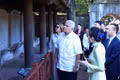 President of the Republic of Panama José Raúl Mulino and the First Lady listen to an introduction to the doctoral stelae. (Photo: Tuan Anh/VNA)