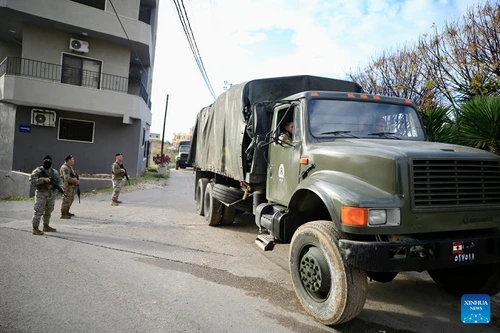 Soldiers from the Lebanese army guard trucks carrying weapons received from the Ain al-Hilweh Palestinian refugee camp in Sidon, Lebanon, Dec. 30, 2025. The Lebanese army on Tuesday received the fifth batch of weapons handed over from Palestinian refugee camps in Lebanon, as part of a state-led plan to centralize arms under national authority. (Photo: Xinhua)