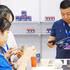 Customers use smartphones to access product information through QR codes. Photo: NAM ANH