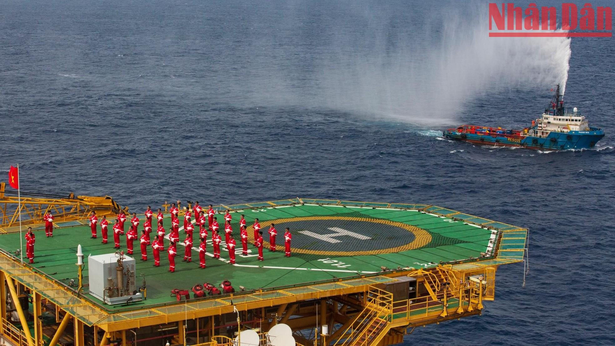 The flag-raising ceremony took place on the helipad of the rig.