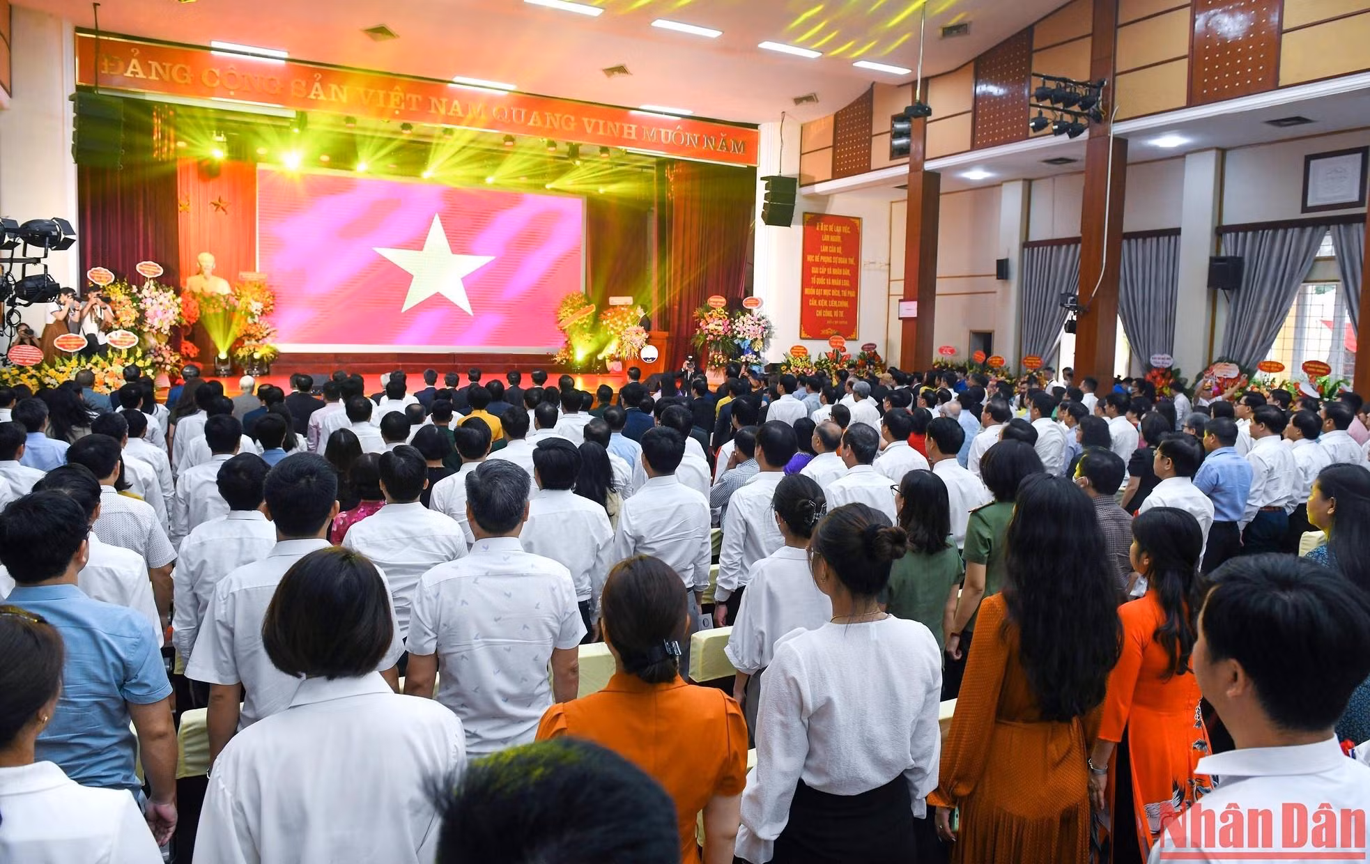 The delegates perform the flag-raising ceremony.
