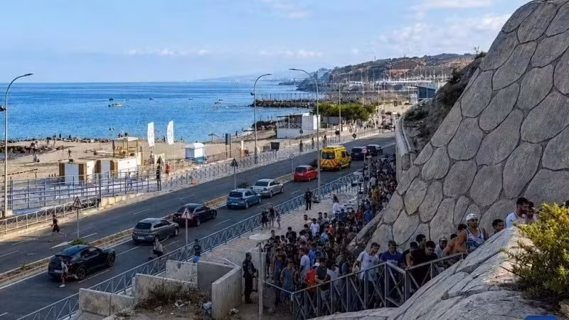 Migrants illegally cross the border into Ceuta, a Spanish territory in North Africa, on July 30, 2026. (Photo: Xinhua)