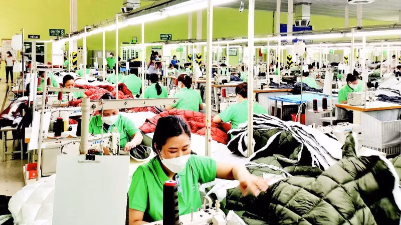 Production of textiles and garments for export at Nam Dinh Textile and Garment Joint Stock Corporation.