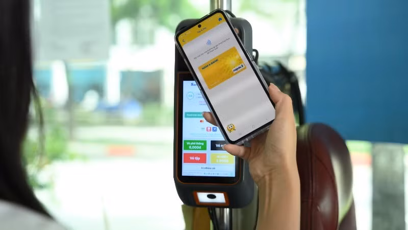Contactless payment with domestic ATM cards on buses in Ho Chi Minh City.