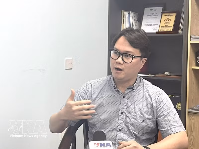 Malaysia-based researcher Enzo Sim Hong Jun grants an interview to the Vietnam News Agency. (Photo: VNA)
