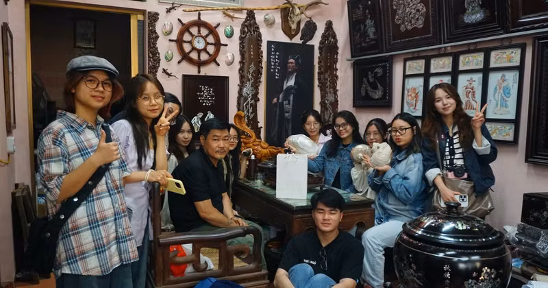 Members of the project team learn about the art of mother-of-pearl inlay in Chuon Ngo Craft Village.