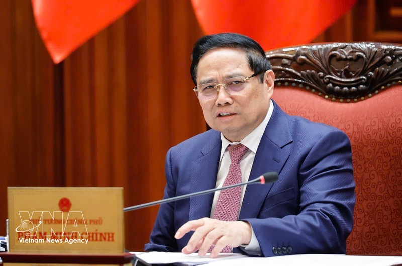 Prime Minister Pham Minh Chinh speaks at the meeting (Photo: VNA)