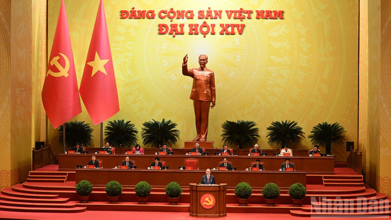 General Secretary To Lam presents a report on the documents submitted to the 14th National Congress of the Communist Party of Viet Nam at the opening session. (Photo: TRAN HAI)