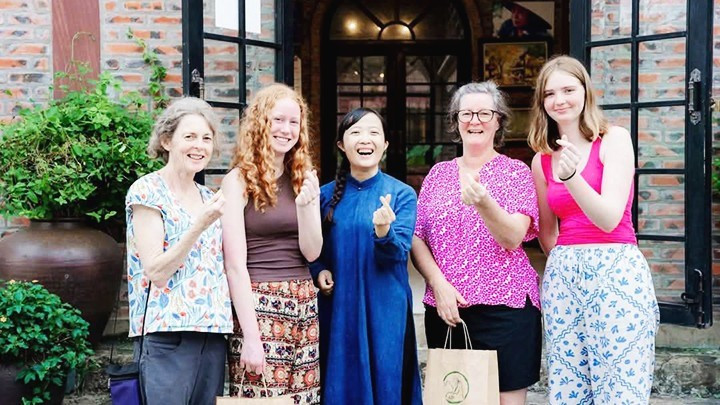 International visitors engaging with the cultural experiences at Sinh Duoc.