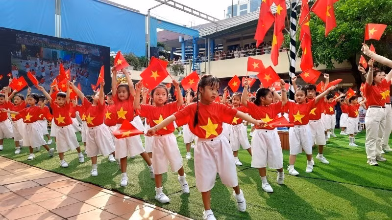 Kindergarten pupils in Ho Chi Minh City perform in a mass artistic display.