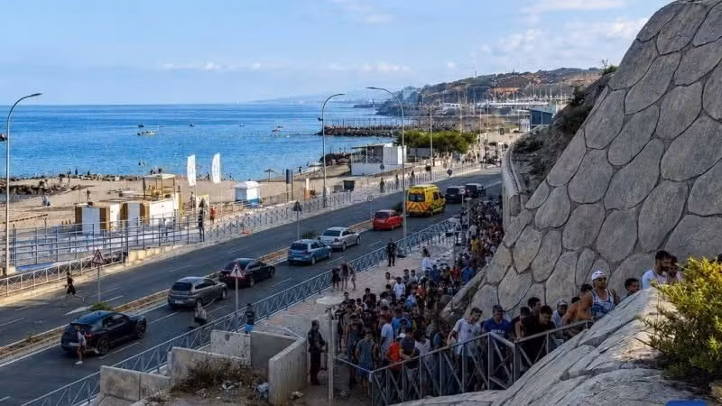 Migrants cross the border illegally into Ceuta, a Spanish enclave in North Africa, on July 30, 2026. (Photo: Xinhua)