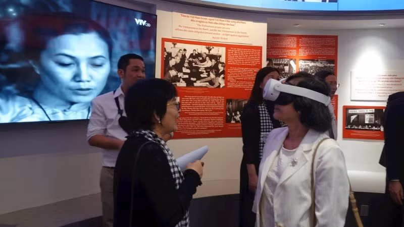 Delegates explore a digital interactive exhibition space at the War Remnants Museum.