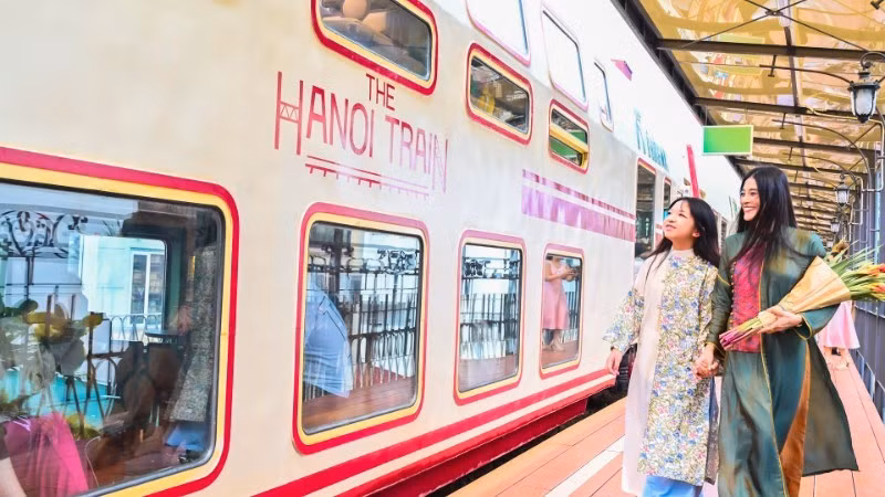 Tourists experience the ‘Ha Noi 5 Gates’ tourist train, a new tourism product in Ha Noi. (Photo: Bao Long)