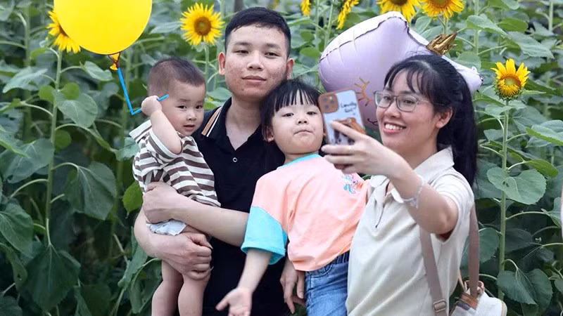 A young family enjoying time with their children – a model to be encouraged amidst declining fertility. (Photo by NHU Y)