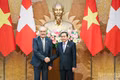 National Assembly President Tran Thanh Man (R) meets with Swiss President Guy Parmelin in Ha Noi on October 18 (Photo: NDO)