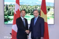 General Secretary of the Communist Party of Viet Nam Central Committee and President To Lam (right) meets with Toshiyuki Onuma, President of the International Civil Aviation Organisation (ICAO) Council, in Canada on September 25 (local time). (Photo: VNA)