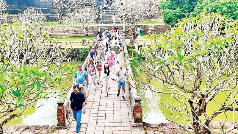 International tourists visit a heritage site in Hue.